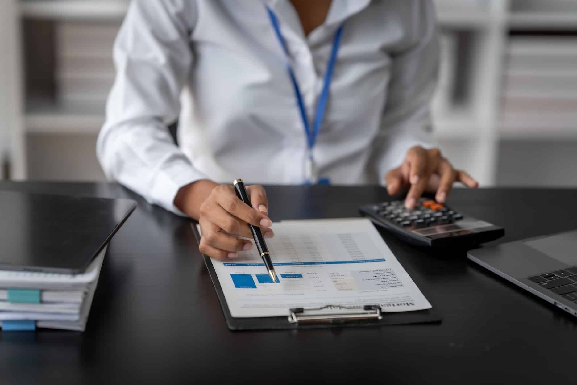Accountant reviewing financial records for UAE liquidation report.