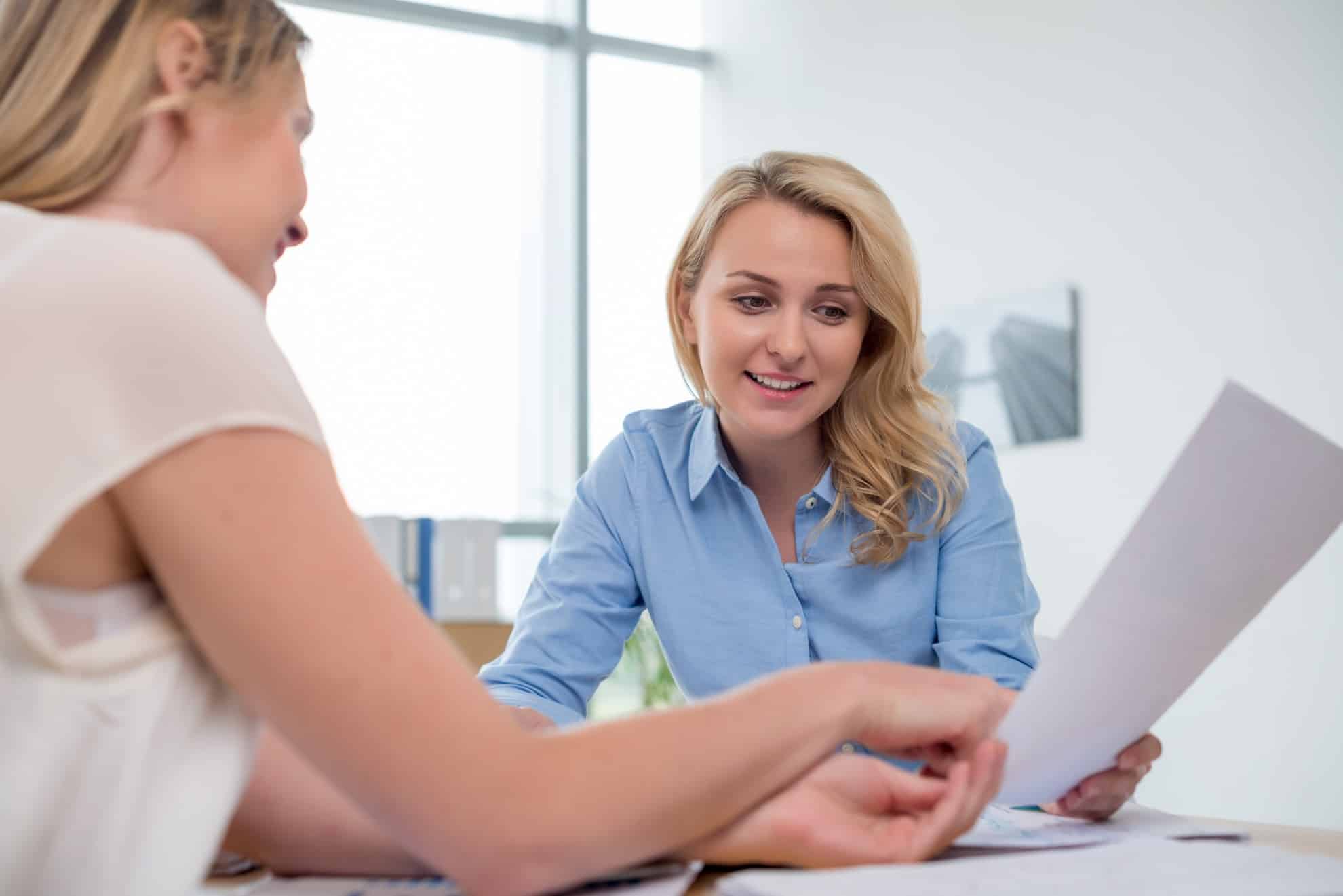 TaxReady.ae professional helping their client write an NOC letter for their visa.