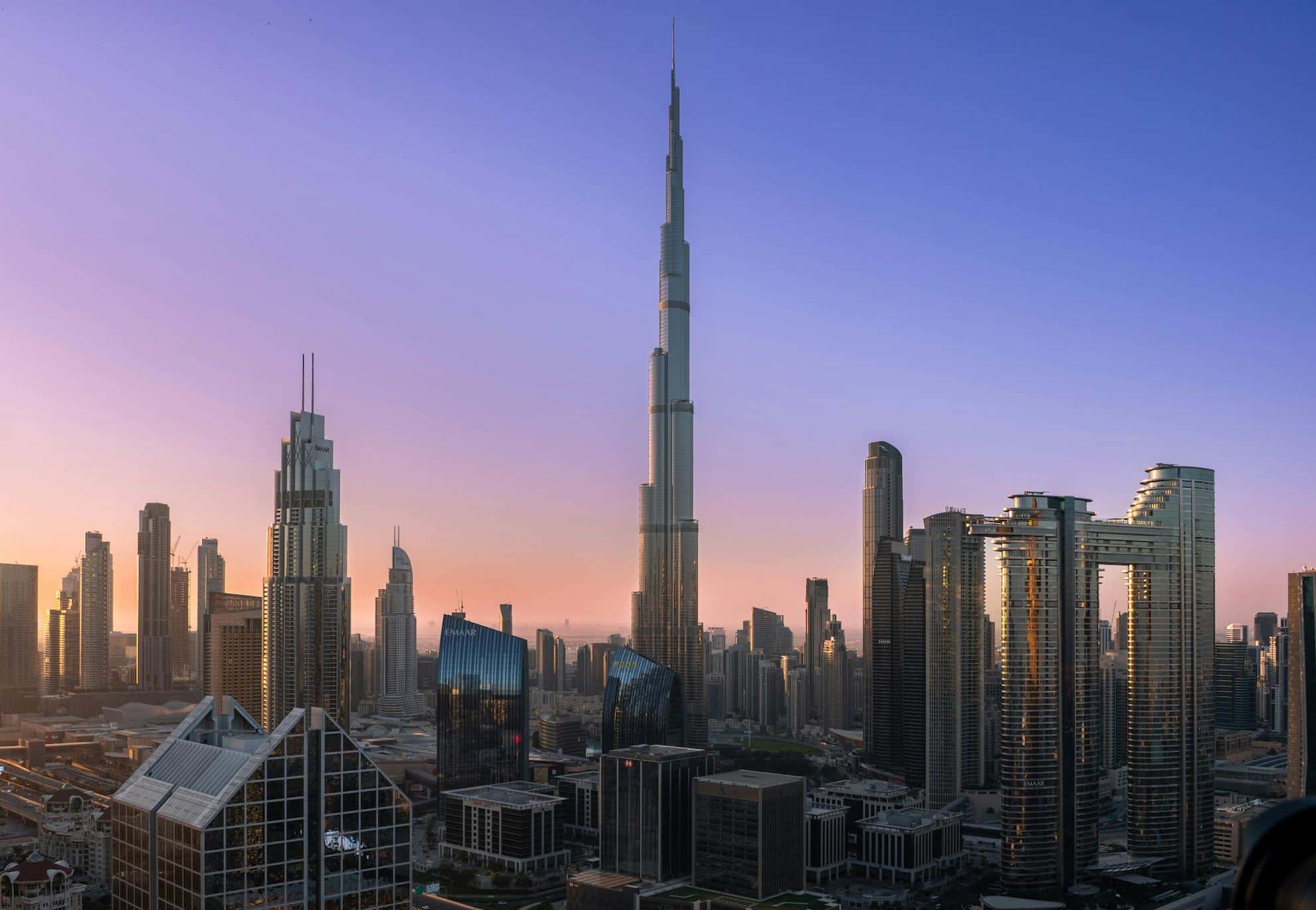 Sunrise view of Downtown Dubai skyline featuring Burj Khalifa and surrounding commercial towers, representing UAE’s prime business real estate district.